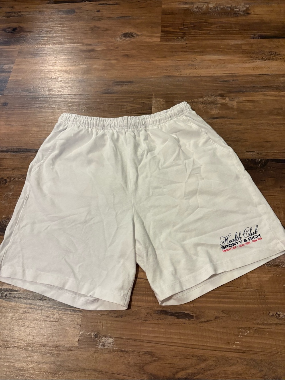 Sporty & Rich White Women’s Athletic Shorts with Script Logo Accent